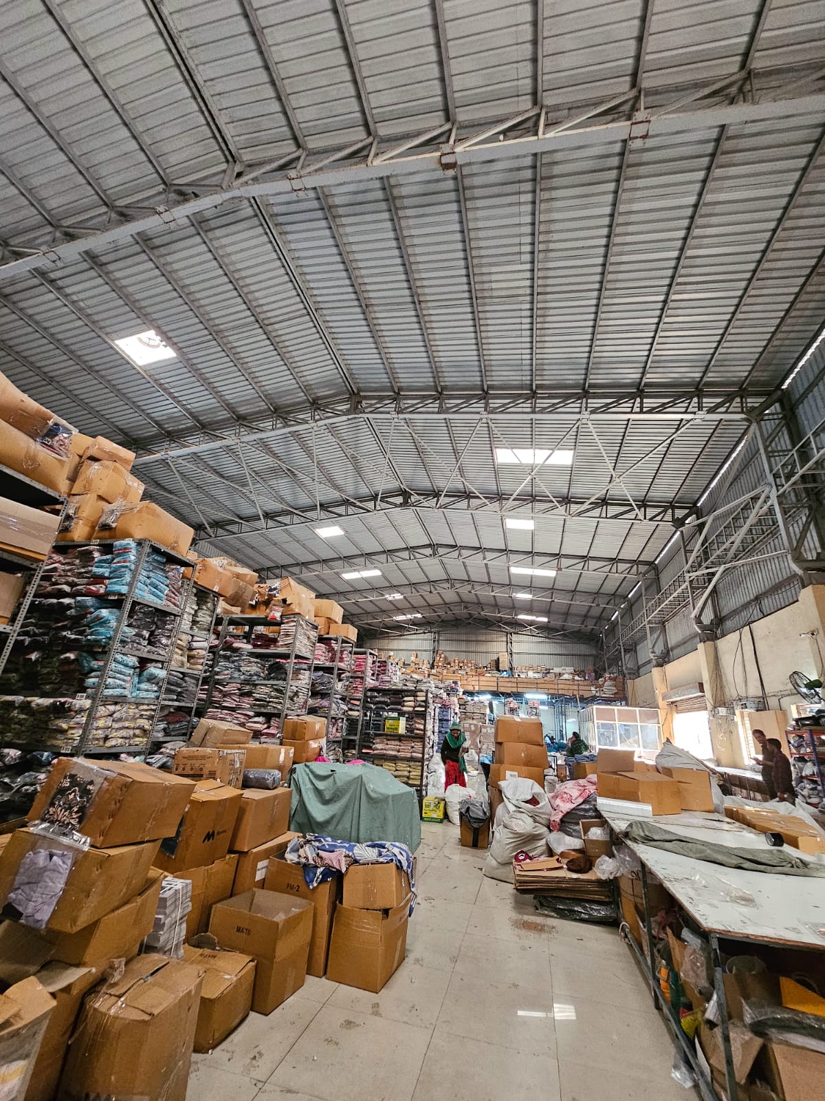 Warehouse 1 interior — high-bay racking under 30 ft roof